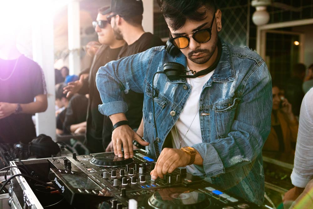 DJ Playing A Gig At A Party