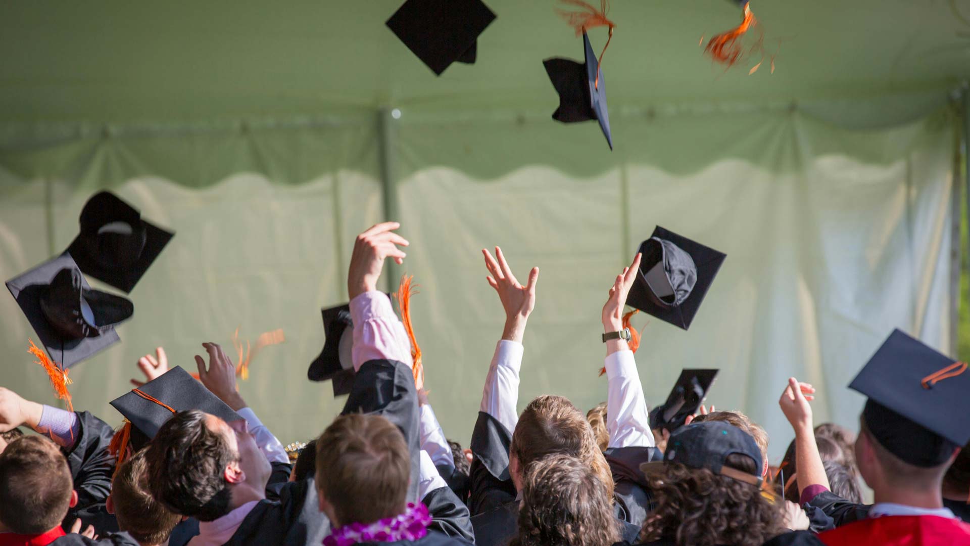 College Graduates Throwing Hats