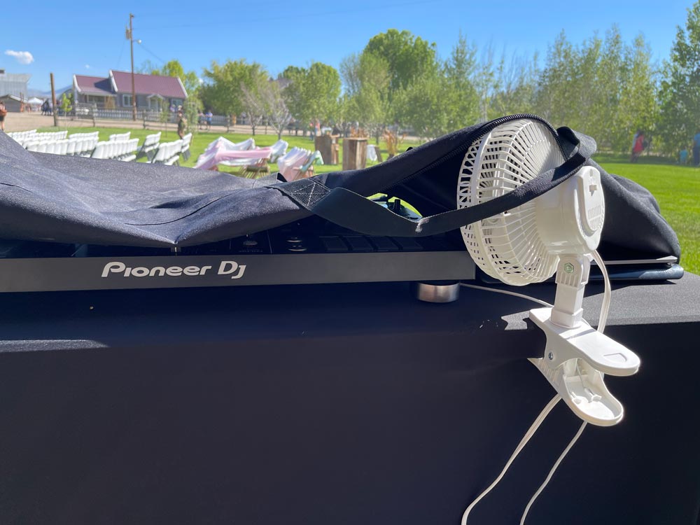 The Idahoan's gear being cooled off with a fan under the bright sun.